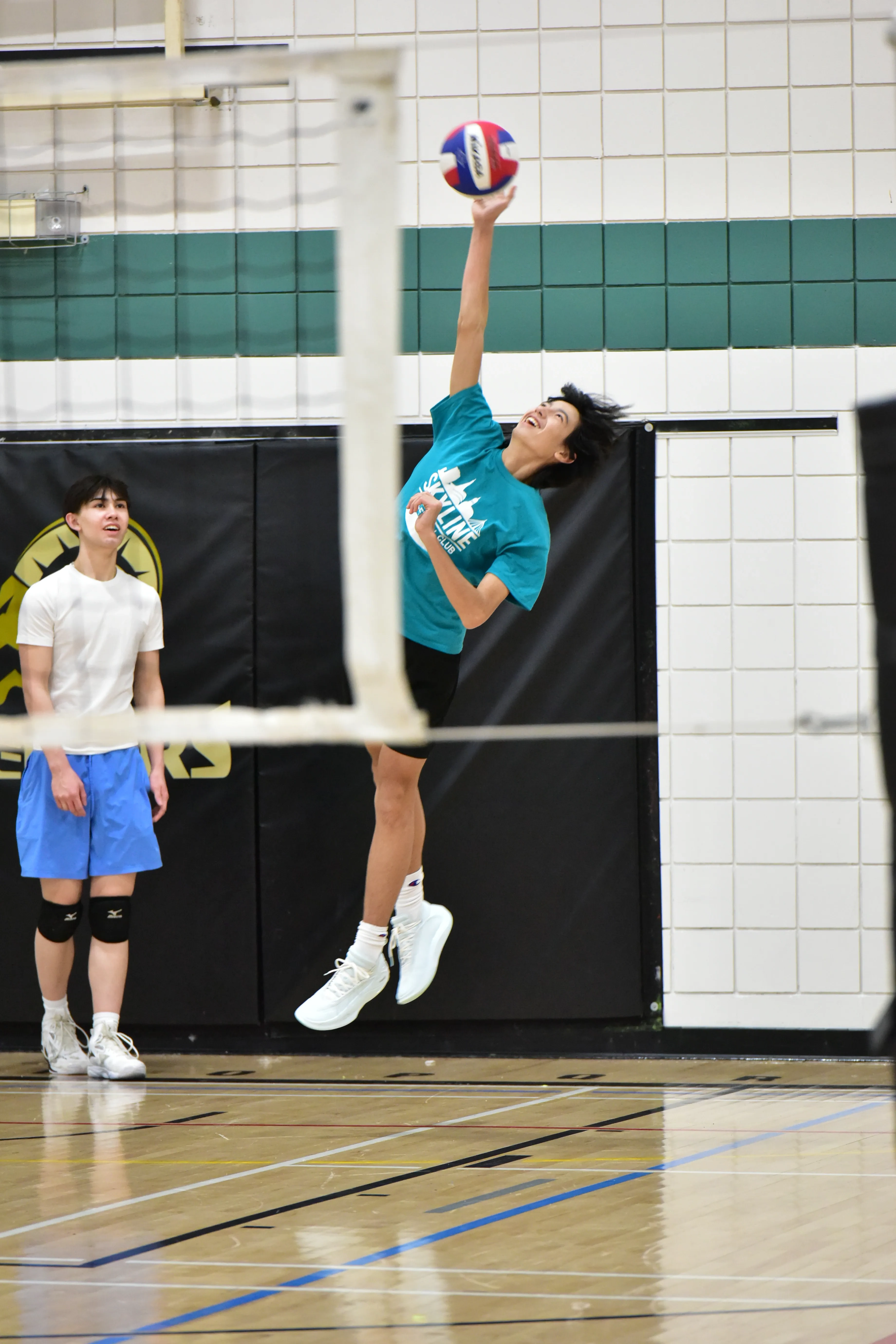 Athletes celebrating after a successful volleyball play
